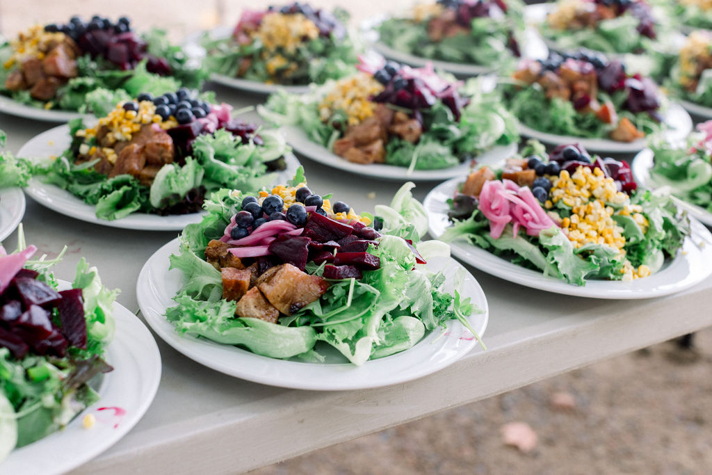 Wedding guests gathered at a reception on the Alpine Garden grounds